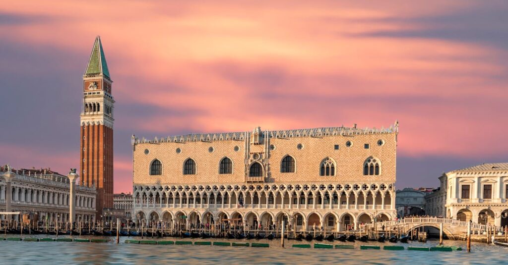 Stunning view of Doge's Palace and St Mark's Campanile during sunset in Venice, Italy.